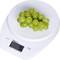 A digital kitchen scale shows 95 grams, with a portion of green grapes resting on the scales.