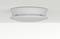 Ceiling-mounted smoke detector with a circular design, featuring slotted sides for air flow, set against a light-colored ceiling surface.