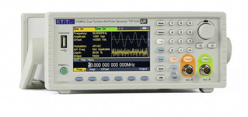 A function generator with a digital display is showing a sinusoidal wave. Buttons and controls for adjustment are visible.