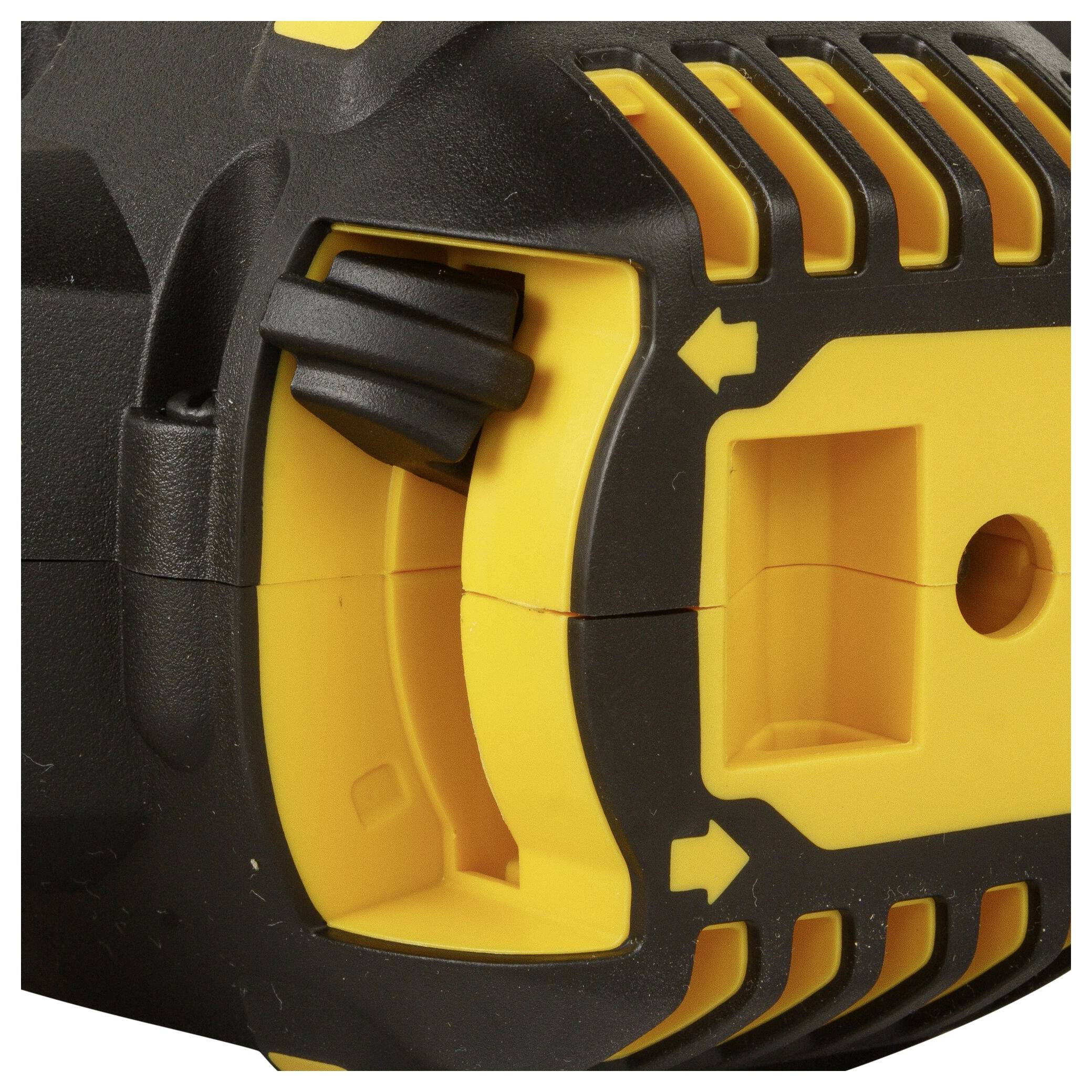Close-up of a black and yellow electric tool handle with directional arrows and ventilation slots on the surface.