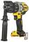 A yellow and black cordless drill with a side grip demonstrates a robust construction, suitable for DIY and trade work.