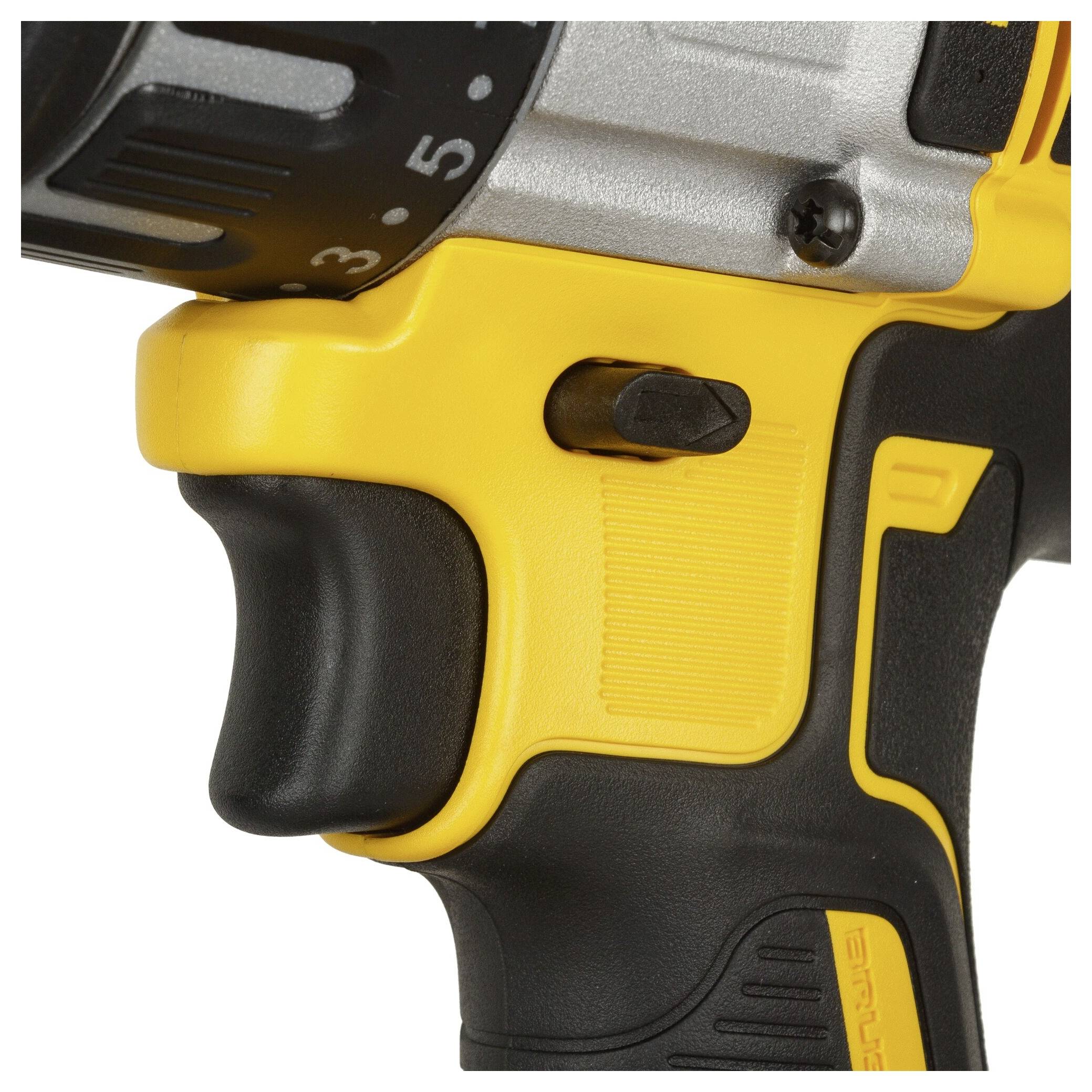 Excerpt of an electric drill with a yellow handle and speed control, with focus on the switch area.
