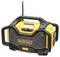 Yellow portable construction site radio with robust casing, large handle and antenna. 'DEWALT' brand name on the front.