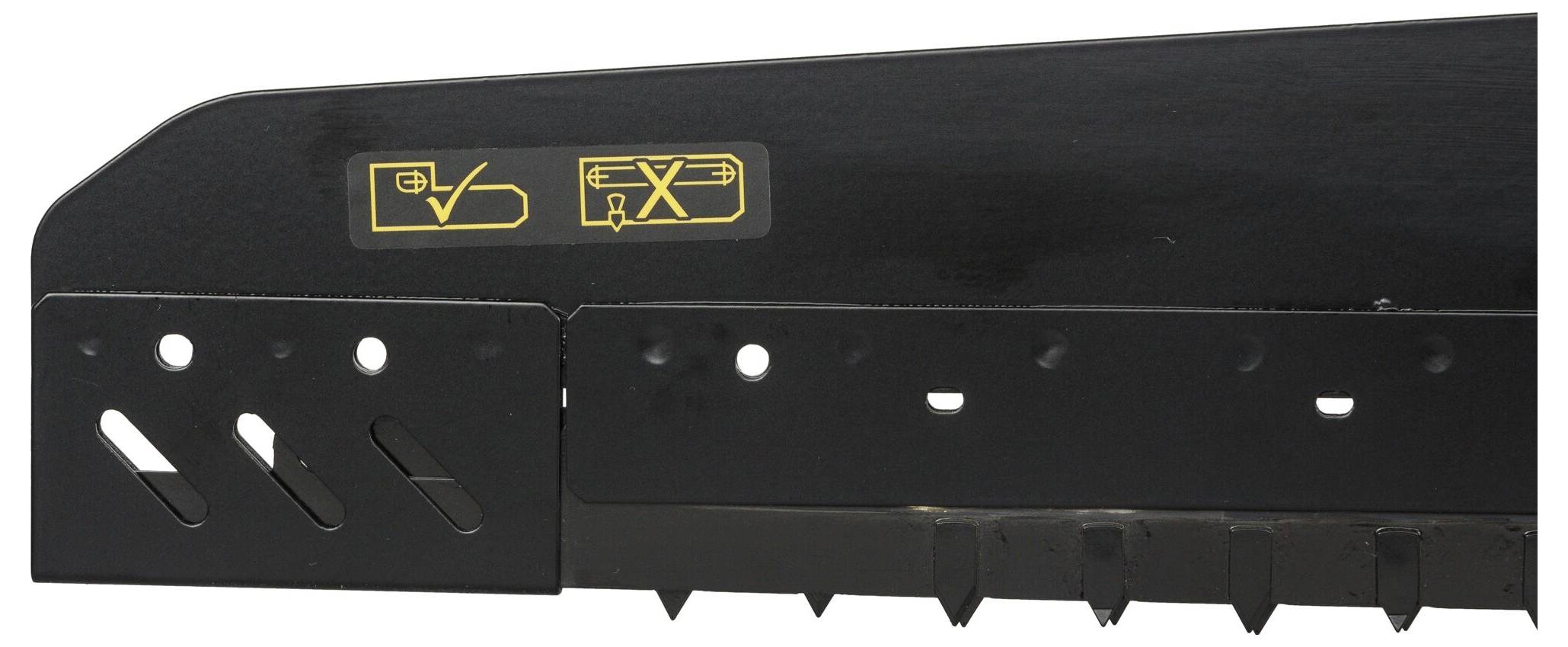 A black metal part with yellow symbols that provides instructions for assembly or alignment.