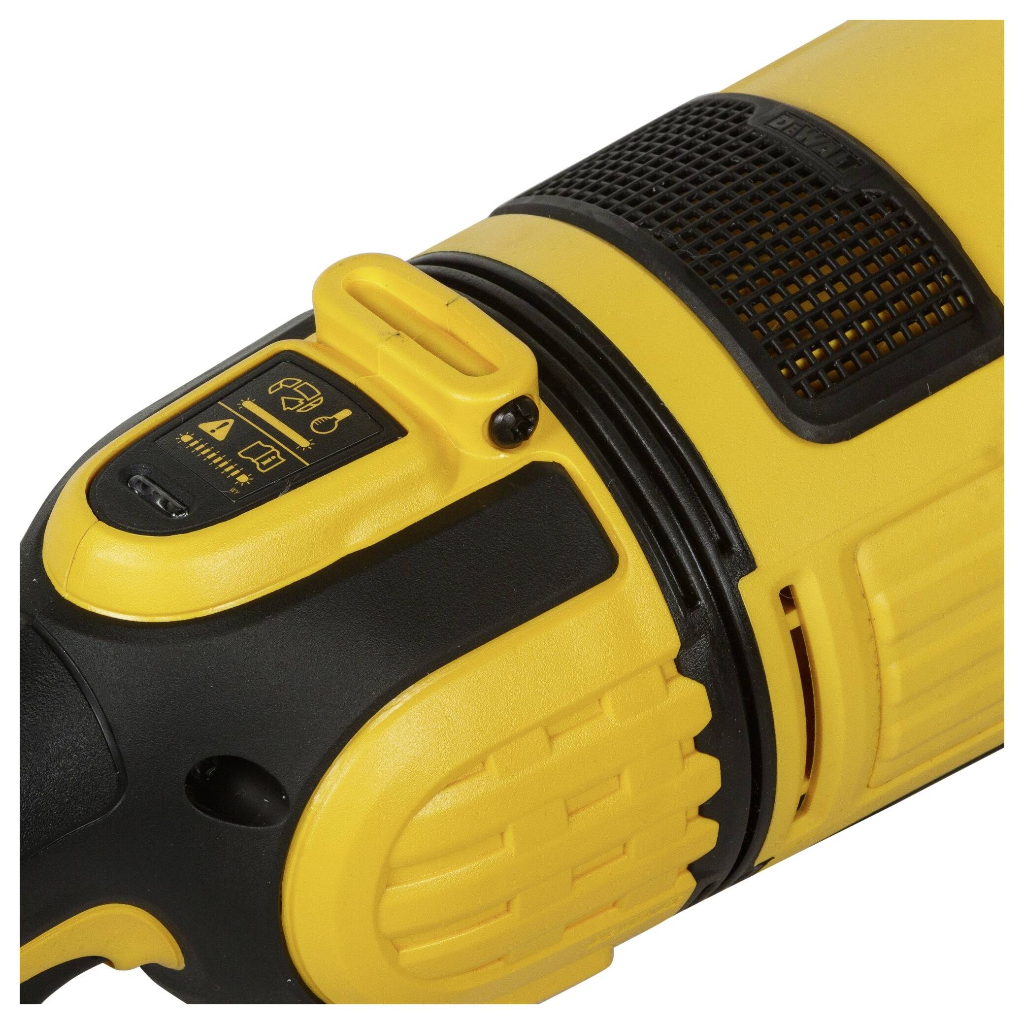 A yellow electrical device, probably a tool, with a black handle and buttons. It has safety symbols on the surface.