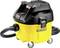 A yellow industrial vacuum cleaner with a black lid and hose, mounted on four wheels. The brand is 'DeWalt'.