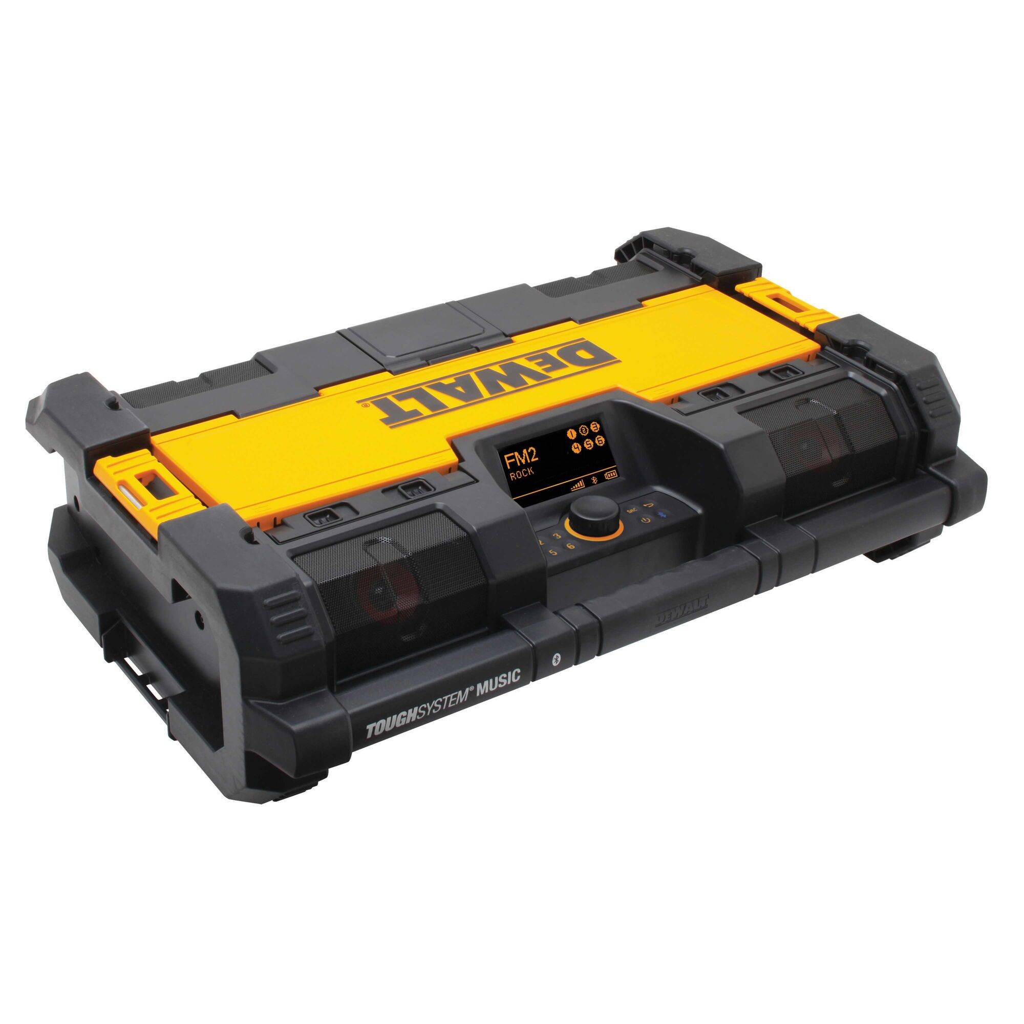 Portable site radio in black and yellow design with speaker grilles and control elements. Marked 'ToughSystem Music'.