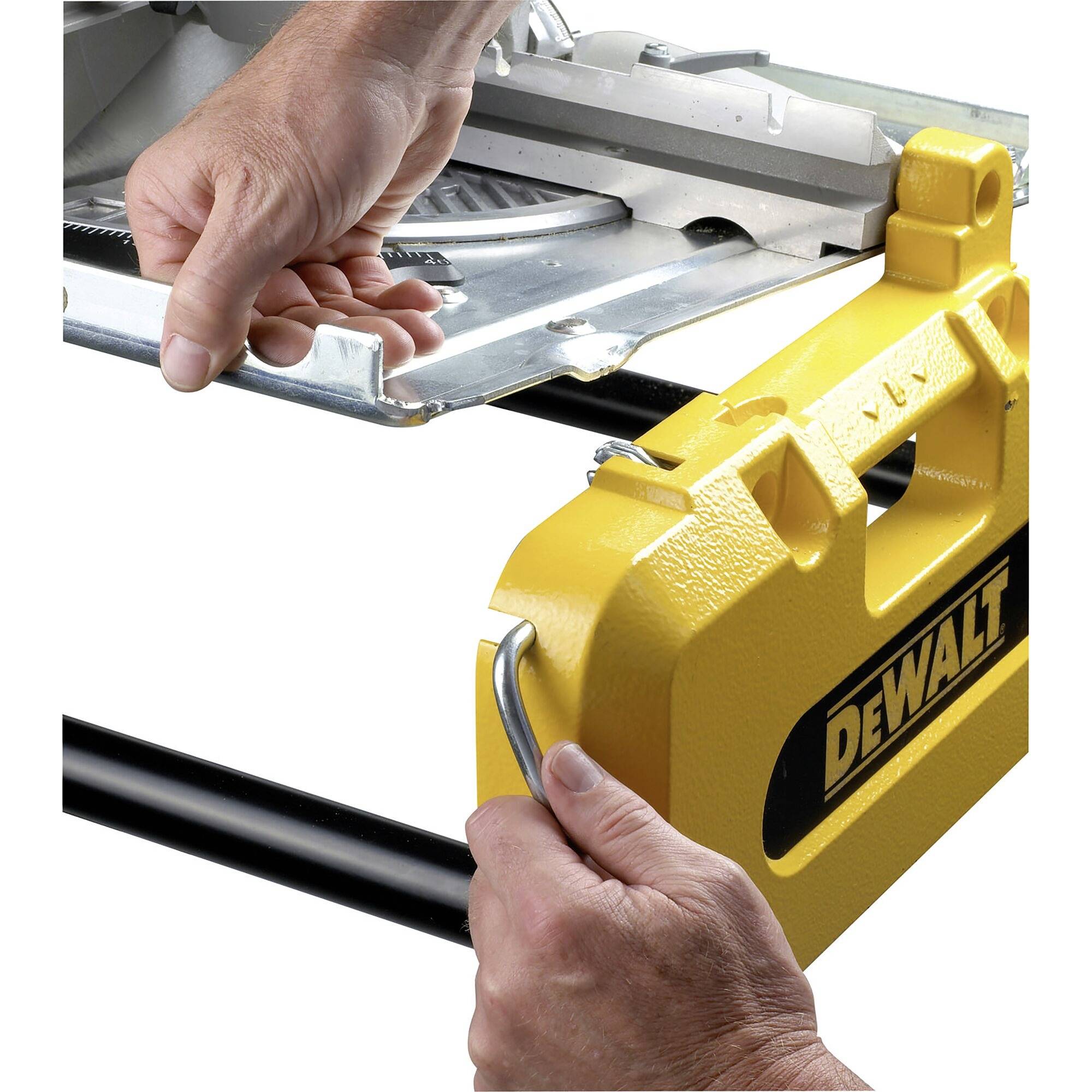 A person is installing the yellow protective cover of an electric circular saw.