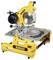 Mitre saw from a well-known brand, yellow and black, standing on a table. Suitable for precise woodcutting.