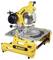 Yellow and black mitre saw by DeWalt on a table, ready for use in woodworking.