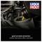 A bottle of oil is poured over an engine, next to the 'LIQUI MOLY' logo and the text 'good corrosion protection, quick oil supply at low temperatures'.