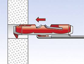 Example of a mechanical fixation in a wall. An anchor is inserted into a perforated wall on the right, with a red arrow indicating the direction of insertion.