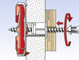 The illustration shows an assembly of a wall plug being inserted into a wall with a screwdriver. The wall plug secures a wooden board to the wall.