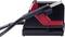 A black and red electric device with a handle and hose, likely a cleaning or household appliance.