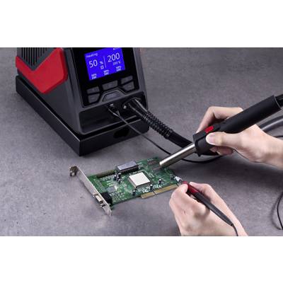 A person is soldering a green circuit board, holding a soldering iron and tweezers. The soldering iron station shows temperature: 50°C, air: 200.