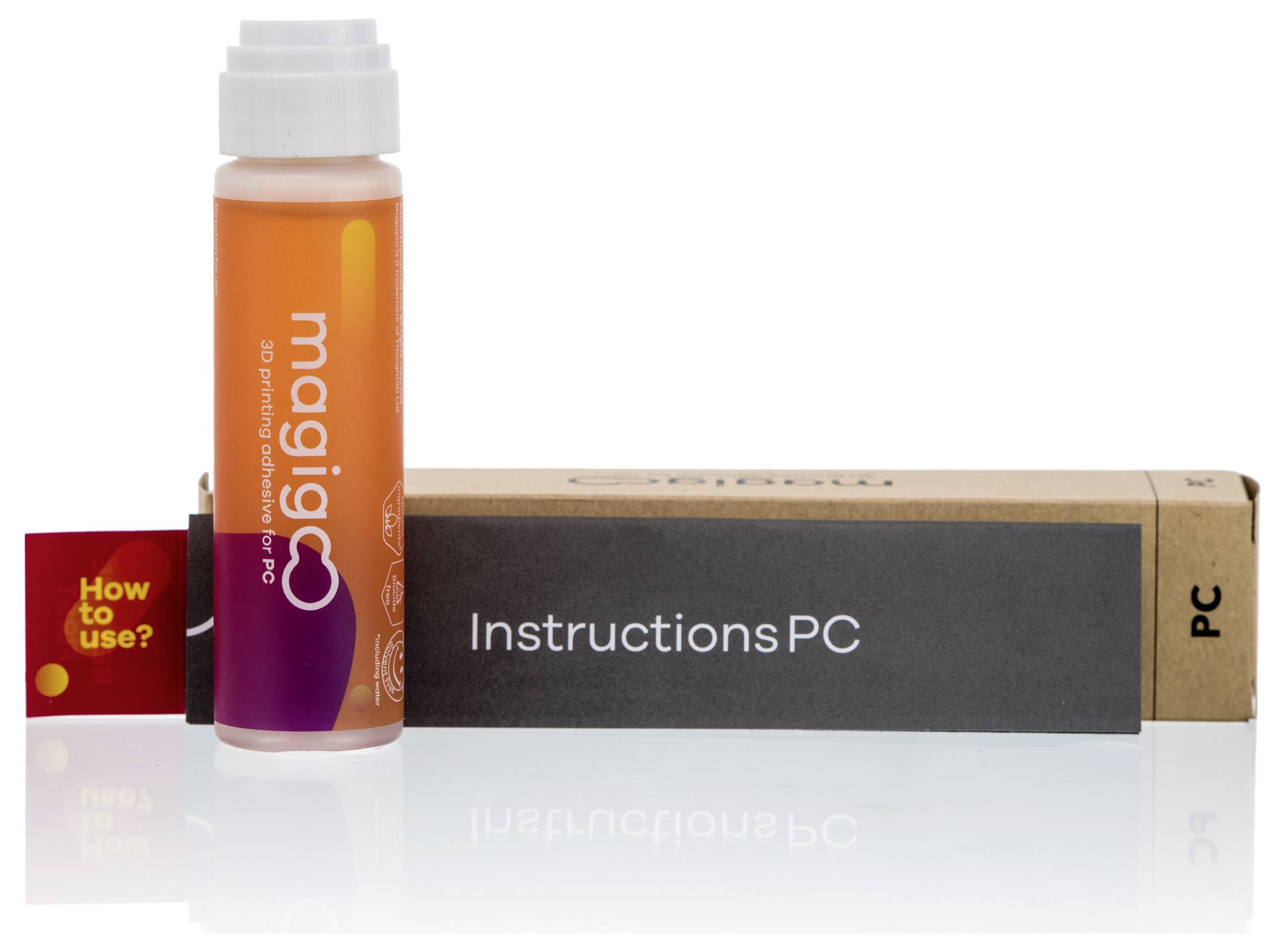 A small bottle with orange liquid and the label 'magic PC' sits in front of packaging marked 'Instructions PC'. Beside it is a red label reading 'How to use?'.
