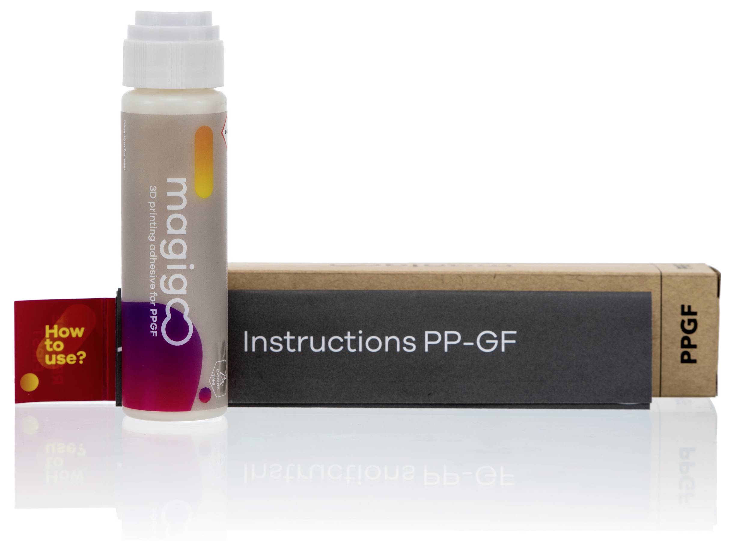 Small bottle of 'magigoo pro' next to a box labelled 'Instructions PP-GF' and a small red leaflet 'How to use?'.