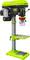 Green pillar drill with metal stand, large buttons and drill head. Suitable for woodworking and metalworking in workshops.