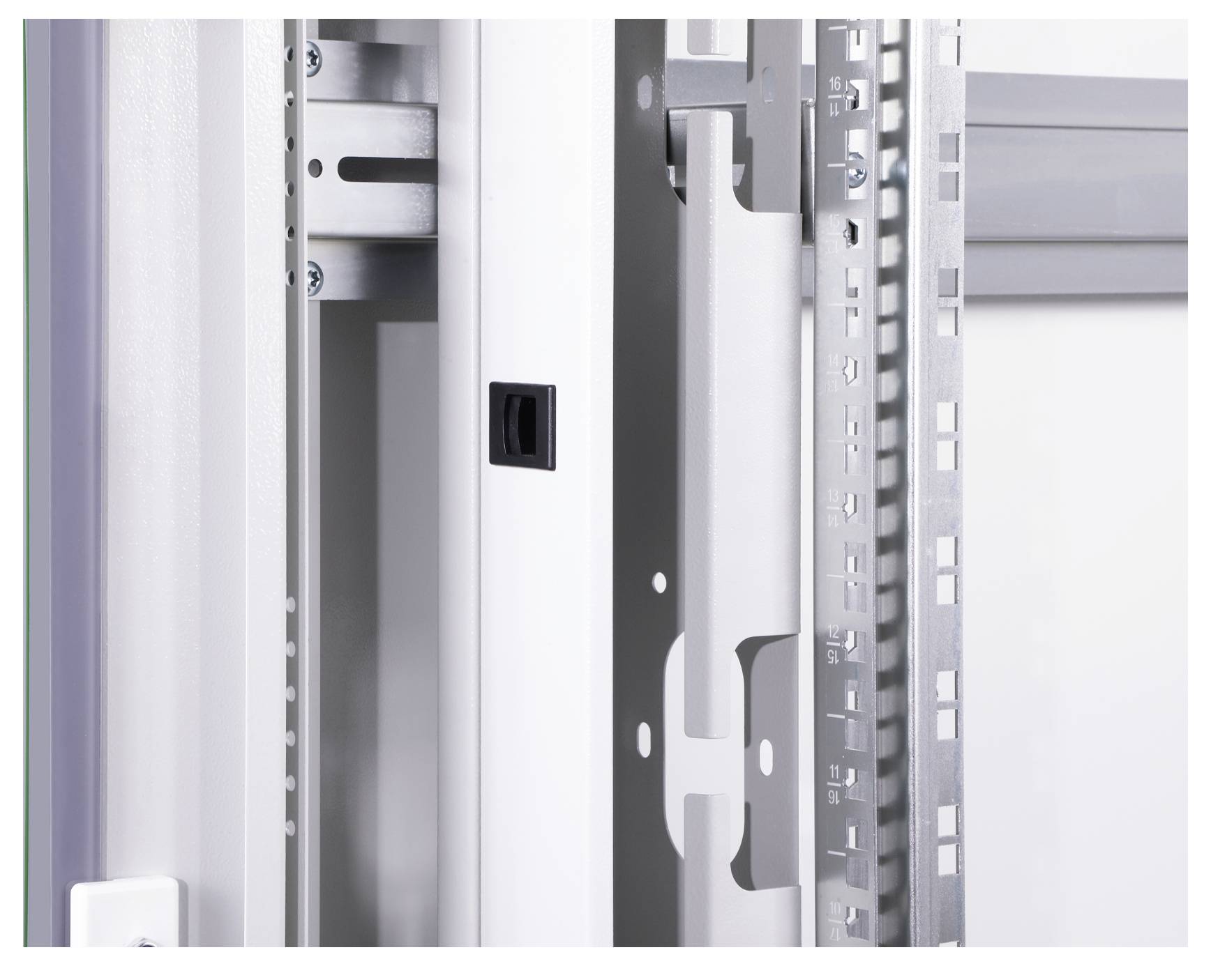 An open metal cabinet shows a side and rear view of its structural elements. Rails with a perforated pattern are visible.