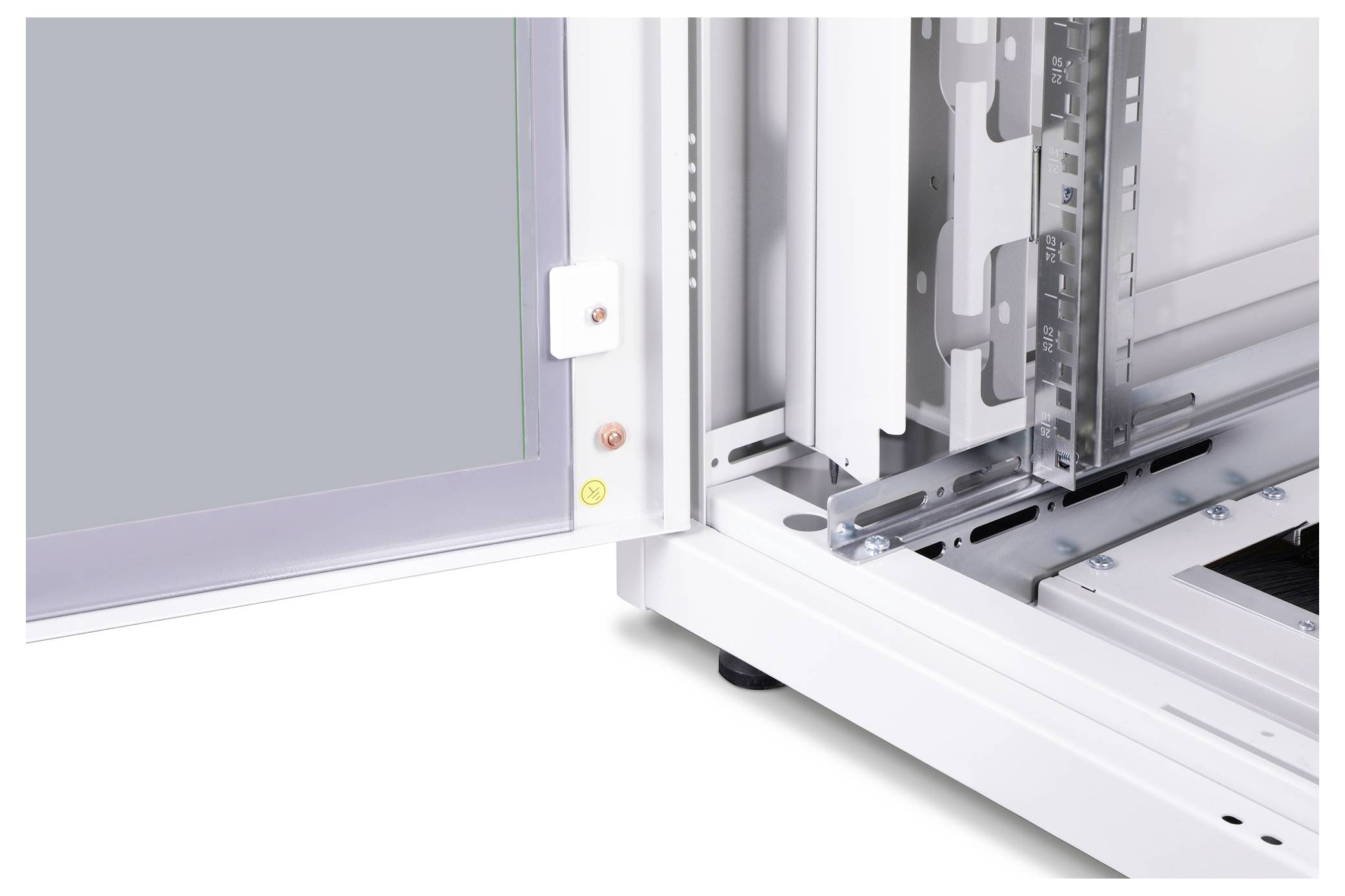 Open door of a technical enclosure, showing hinges and internal metal structures.