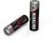 Two AA alkaline batteries, one standing, the other lying down. Brand name and polarity symbols visible on the casings.