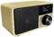 Wooden radio with digital display shows 'Koffee - Time to Chill'. Large volume button and mode selector switch on the front.