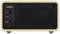 The image shows the back of a black and beige speaker with connections for antenna, AUX, and power supply.