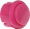A pink plastic button, used as a control element or switch in electronic devices.