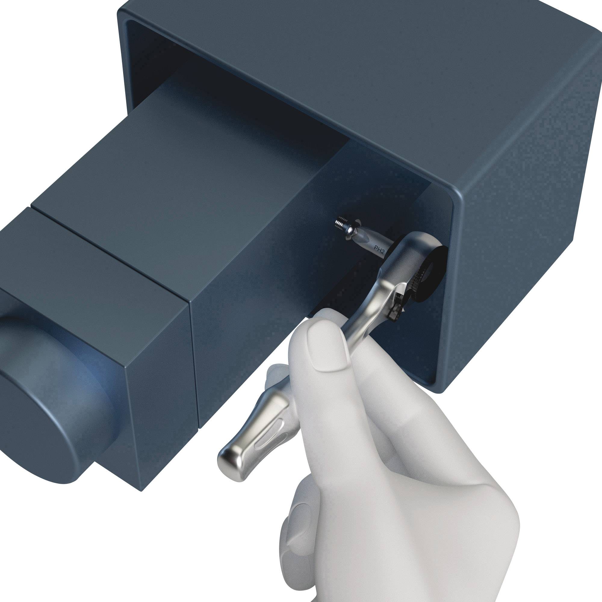 A hand in a glove holds a small metallic tool that is working on or examining an object in a square device.