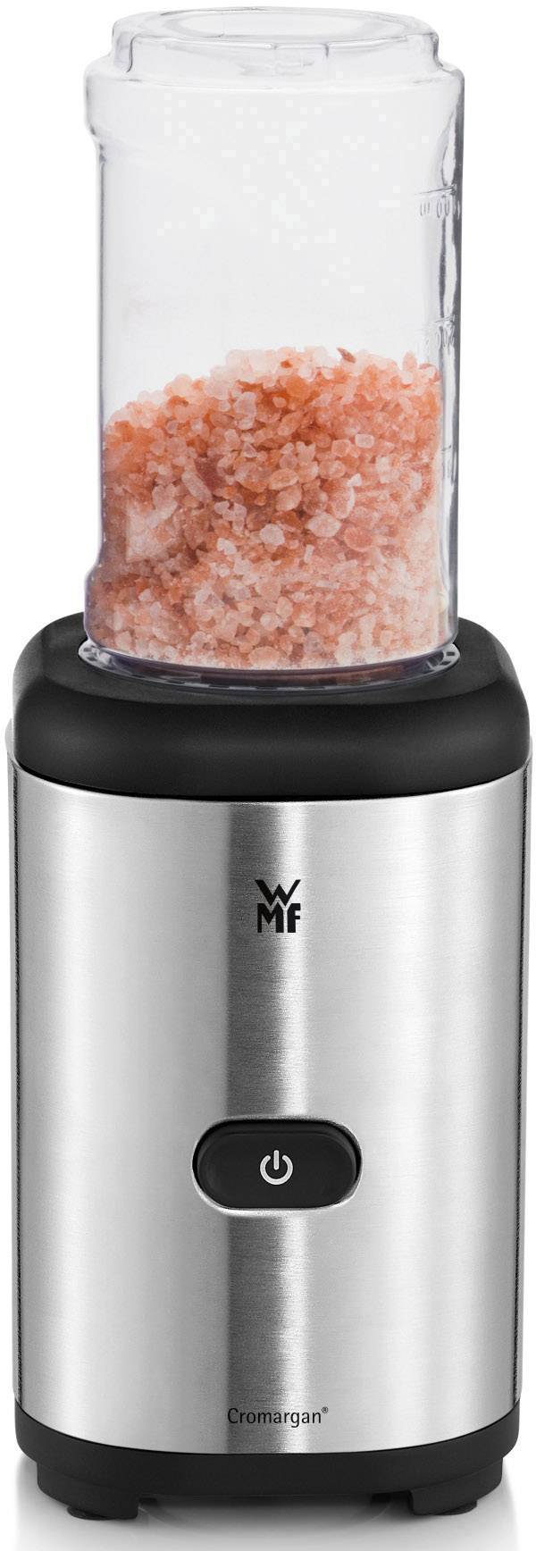 Compact stainless steel electric pepper mill with transparent container, filled with pink salt, marked with WMF logo.