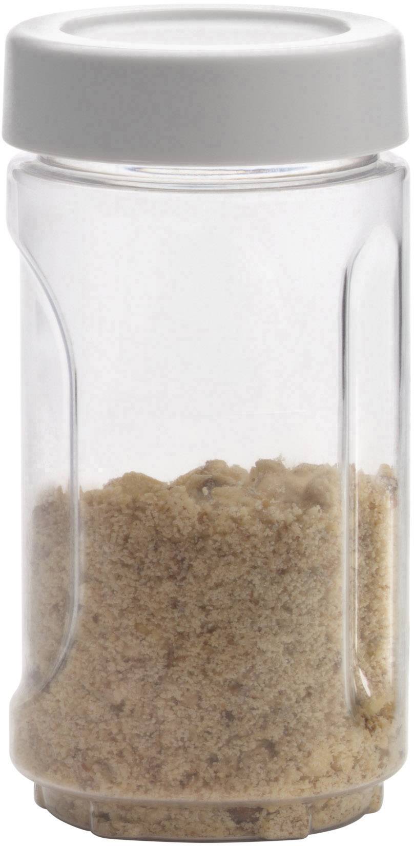 A glass container with a grey lid, filled with brown sugar, on a white background.