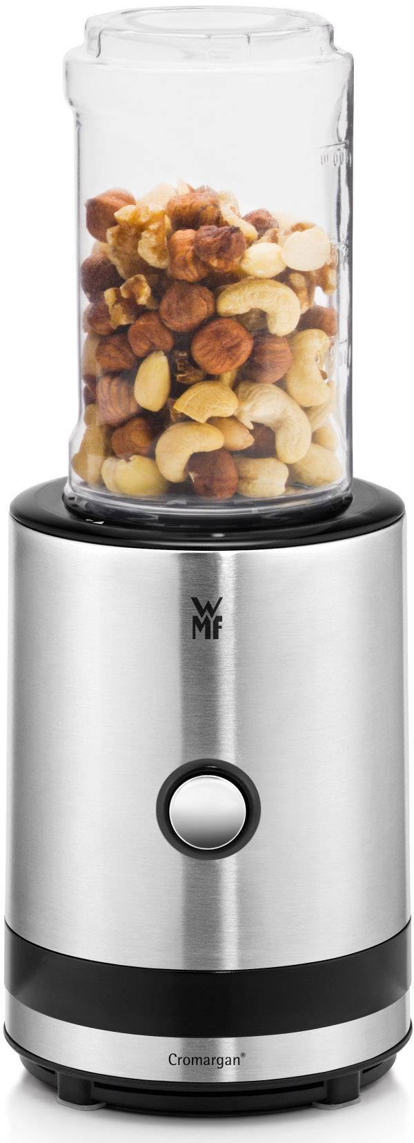 A silver-coloured stand blender with a transparent container, filled with nuts. The blender has a single visible button.