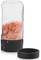 Electric pepper mill with transparent container, filled with pink Himalayan salt. Black lid lies beside it.