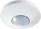 A white round ceiling motion sensor with a central dome-shaped lens, for detecting movement and activating lighting.