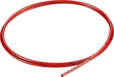 Red plastic hose laid in a circle. Suitable for liquid transport or technical applications.