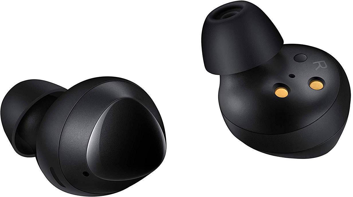 Black wireless earbuds, one lying on its side, the other showing the charging contact points.