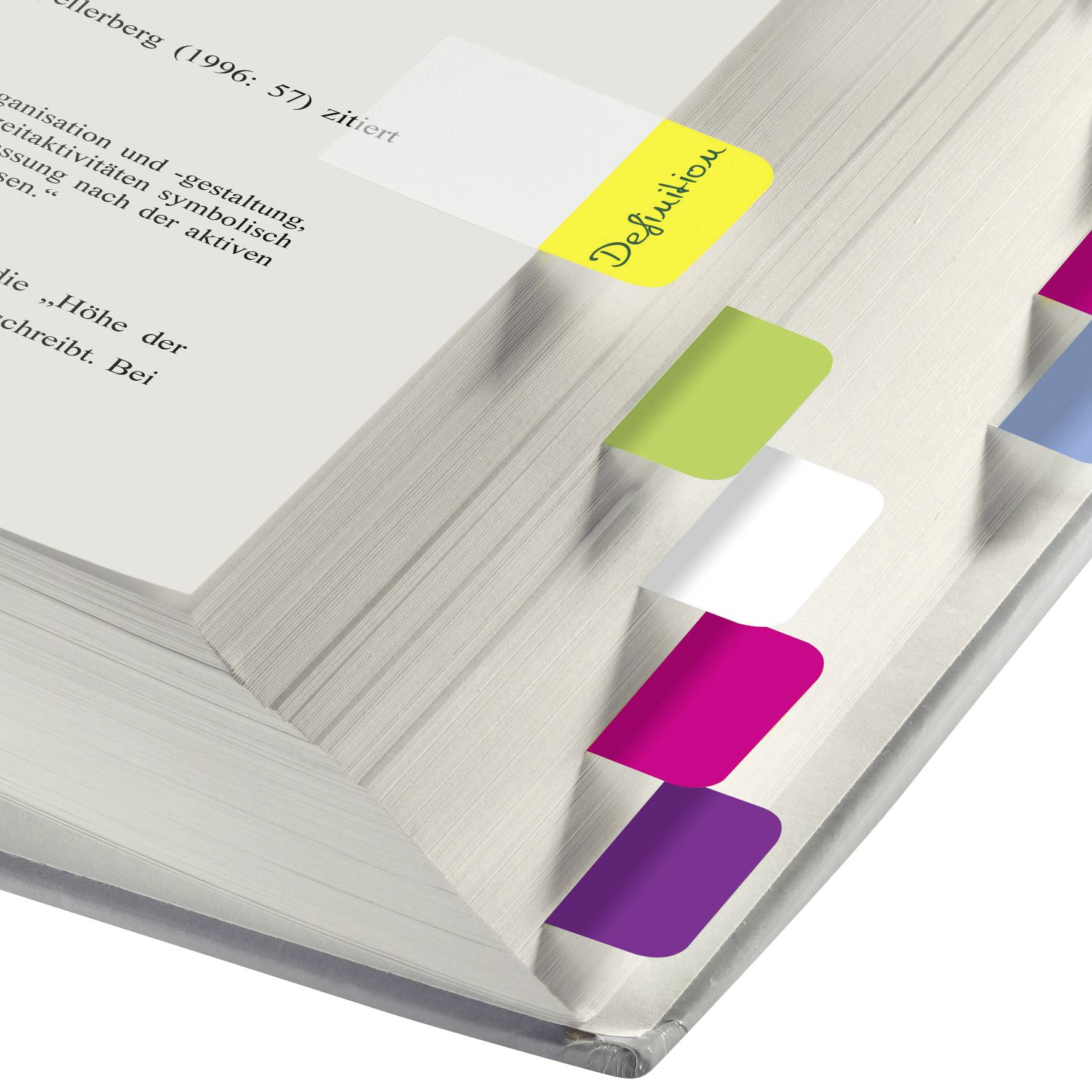 An open book with colourful sticky notes on the pages, serving as tabs. One note is labelled 'Definition'.