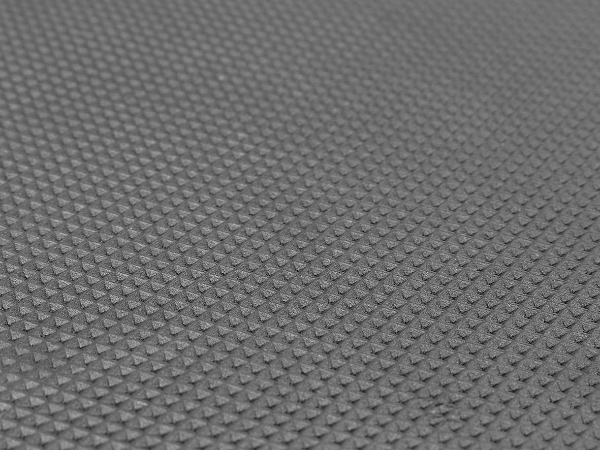 Grey surface with uniform, pyramidal patterns.