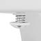 A white push-button plug in a sink plughole, water droplets visible, symbolising plumbing fixtures in the bathroom.