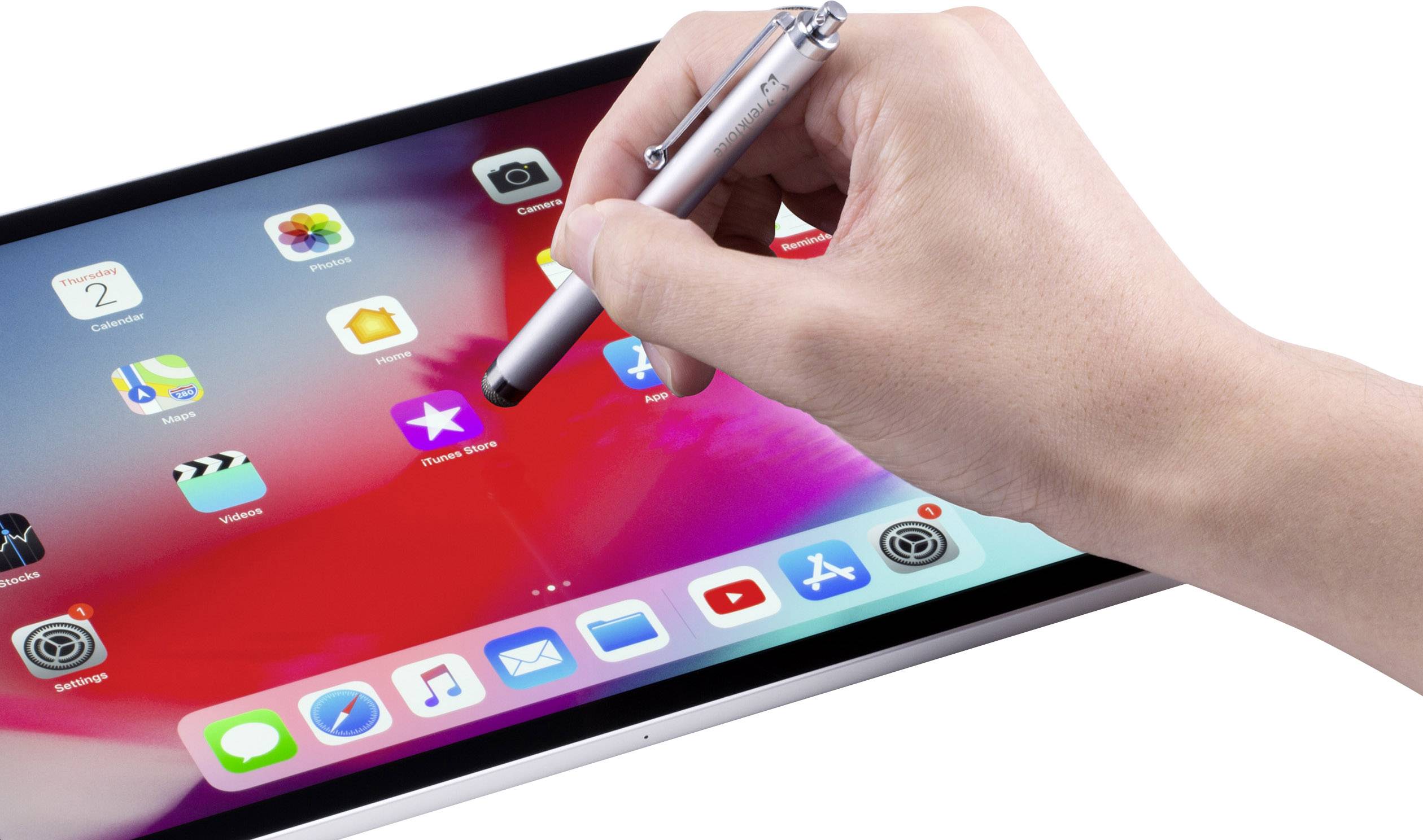 A hand is operating a tablet with a stylus, displaying various app icons.