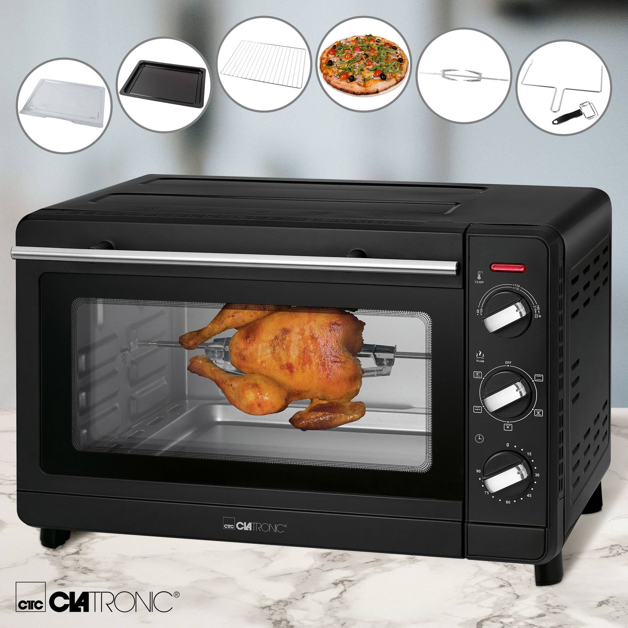 'A black mini oven with a crispy roast chicken on a rotisserie. Accessories: pizza stone, baking tray, crumb tray.'