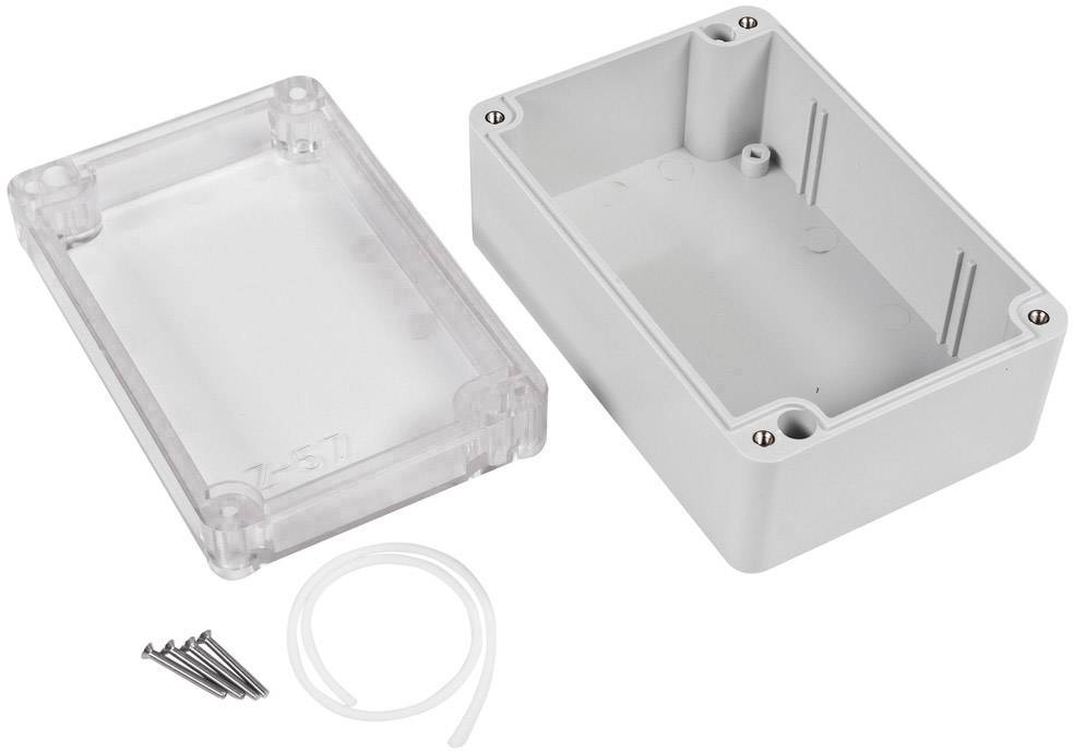 Transparent and grey plastic box opened, with screws and seal beside it.