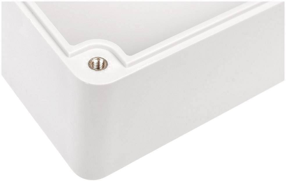White plastic box corner with visible metal screw. Minimalist design, smooth and rounded edges.