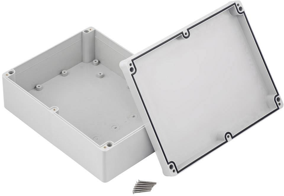 Opened grey plastic box with removed cover, with several screws beside it. Suitable for electrical engineering applications.