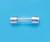 A small glass fuse tube with metal caps at both ends rests on a blue background.
