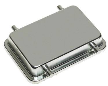 A rectangular, flat metal quartz resonator with rounded corners and four connecting pins, commonly used in electronic circuits.