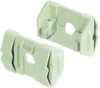 Two green, rectangular plastic parts with holes in the centre. They appear to be components or adapters.
