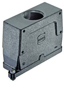 Metallic machine component with a square shape, a large opening at the top and textured surfaces. Brand logo visible.