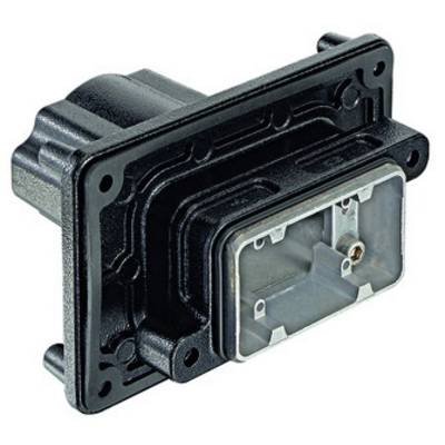 A rectangular black plastic adapter with multiple apertures and connection points; used for electrical assembly.