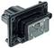 A rectangular black plastic adapter with multiple apertures and connection points; used for electrical assembly.